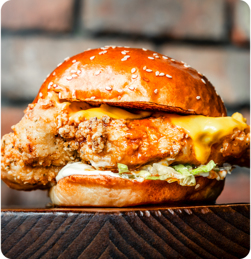 #019 -  Libertine fried chicken breast, American cheese, hot honey, chilli butter, mayo.
