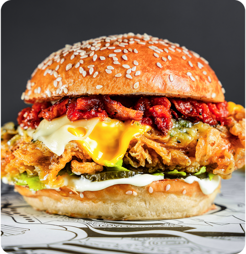 #012 - Libertine fried chicken breast, Swiss cheese, garlic & herb butter, smoked tomato chutney.