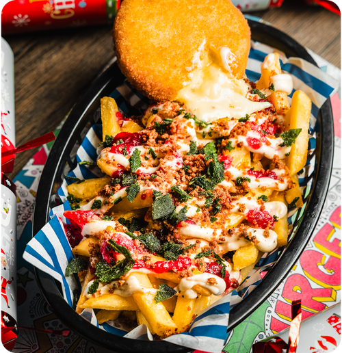 FESTIVE FRIES - House fries topped with American cheese sauce, sage & onion mayo, cranberry sauce.