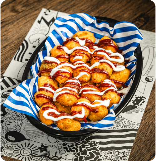 GUNPOWDER TOTS - House tots topped with curry spice mix, gochujang ketchup & honey yoghurt.