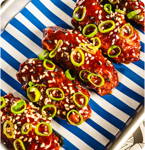 Korean BBQ Wings - Six buttermilk fried chicken wings coated in Korean BBQ sauce.