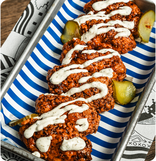 Nashville Hot Wings - Nashville spice mix, hot honey, ranch dressing & pickles.