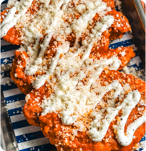 Truffalo Chicken Tenders - 6 buttermilk fried chicken tenders, Buffalo hot sauce, truffle mayo, parmesan.